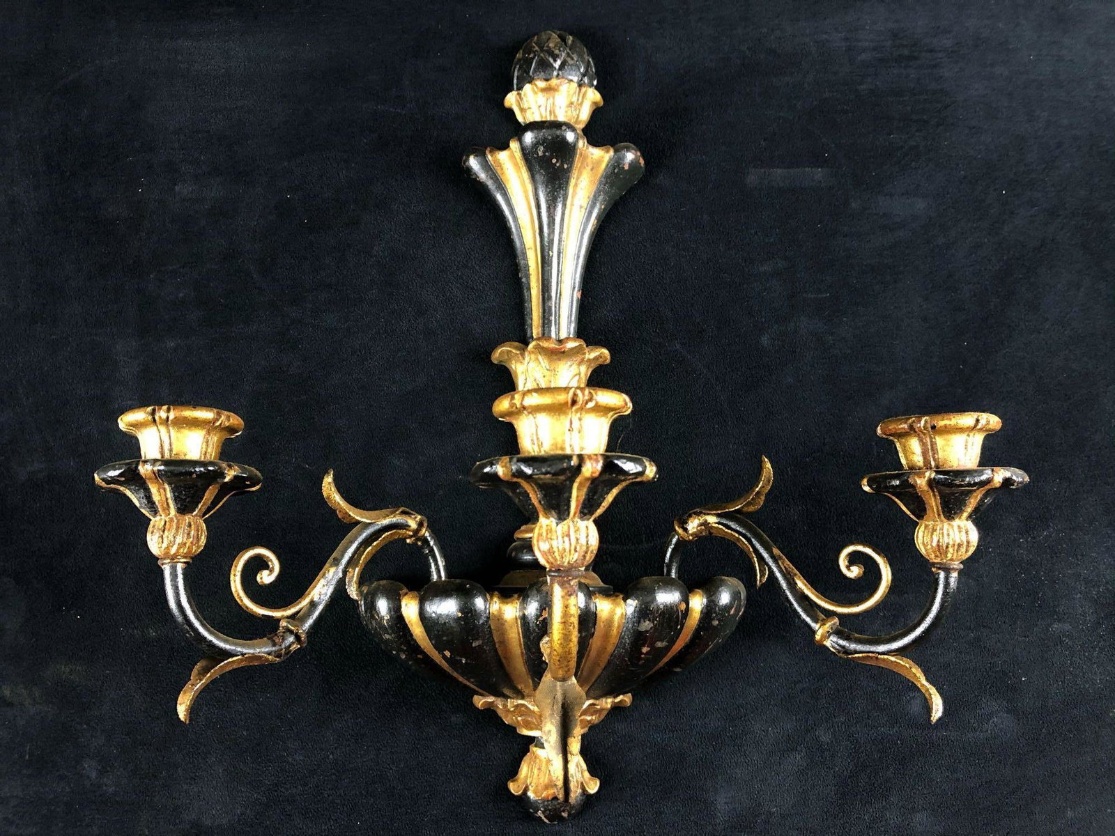Beautiful Midcentury Hollywood Regency Italian Gothic: This is a beautiful Midcentury Hollywood Regency Italian metal and wood candelabra with three arms and three wood candle holders. This stunning black & gold gilded piece is in very good condition with