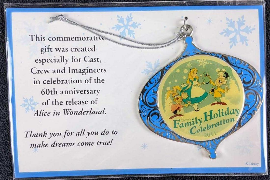 Walt Disney Cast Member Commemorative Ornaments Alice: Walt Disney Cast Member Commemorative Ornaments Alice in Wonderland Land and The Tramp (1) Lady and the Tramp 2010 55th Anniversary Ornament (2) Alice in Wonderland 2011 60th Anniversary Ornament Both