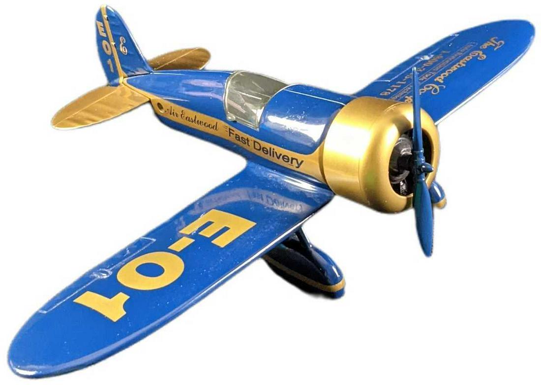 Air Eastwood Fast Delivery Die Cast Metal Plane Bank: Air Eastwood Fast Delivery Die Cast Plane Metal Bank. Comes in its original box which is approx 11 3/4" x 4" x 8 1/2" and it weighs (with the bank inside) 1.44lb. The plane is approx 11" x 7 1/4" x 3"