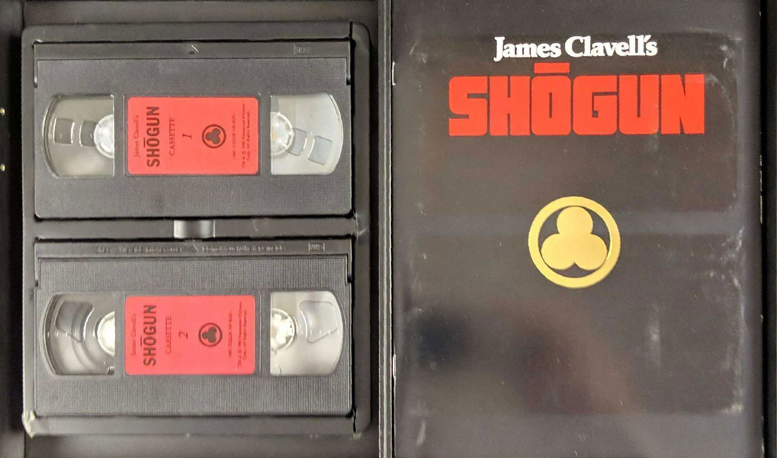 James Clavells Shogun VHS Gift Set: Four VCR tapes of the original mini-series. Comes with a booklet about the show. Everything is in good, unused condition with some wearing on the box and some damage on the bottom corner with packing