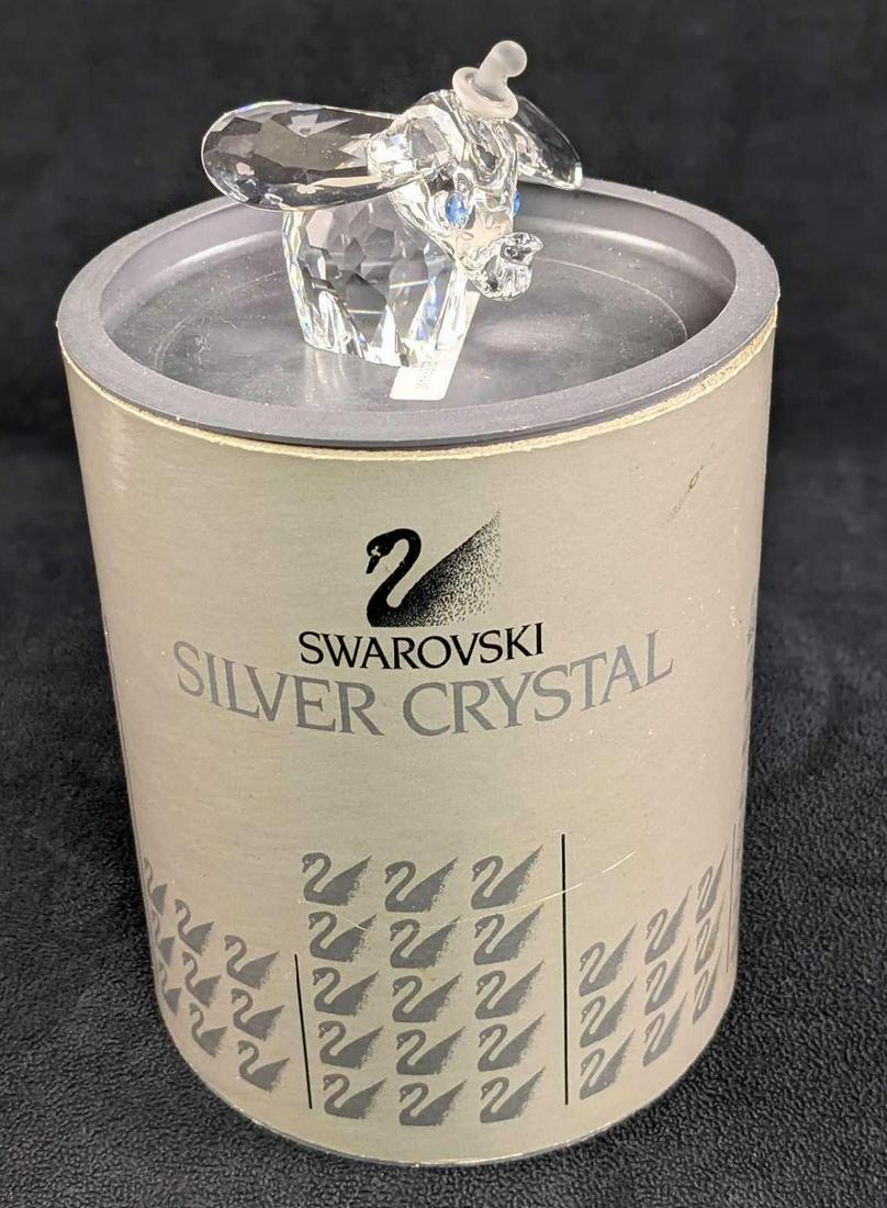 Swavorski Silver Crystal Dumbo Elephant Figurine: This is a Swavorski "Silver Crystal Dumbo" figurine that was released in 1993. It comes inside the original box with its certificate. Swarovski Silver Crystals are made using a combination of natural 