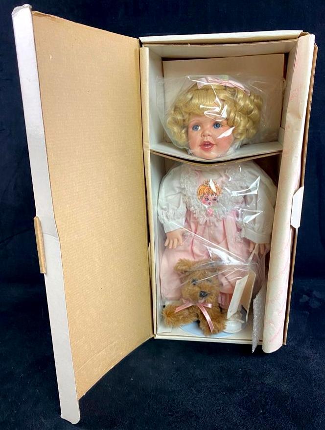 Hamilton Collection 15" Porcelain Doll: Hamilton Collection 15" Porcelain Doll This 1993 porcelain doll, "Lauren", designed by Phyllis Parkins has never been removed from the box, and comes in its original packaging. Approximate size in box
