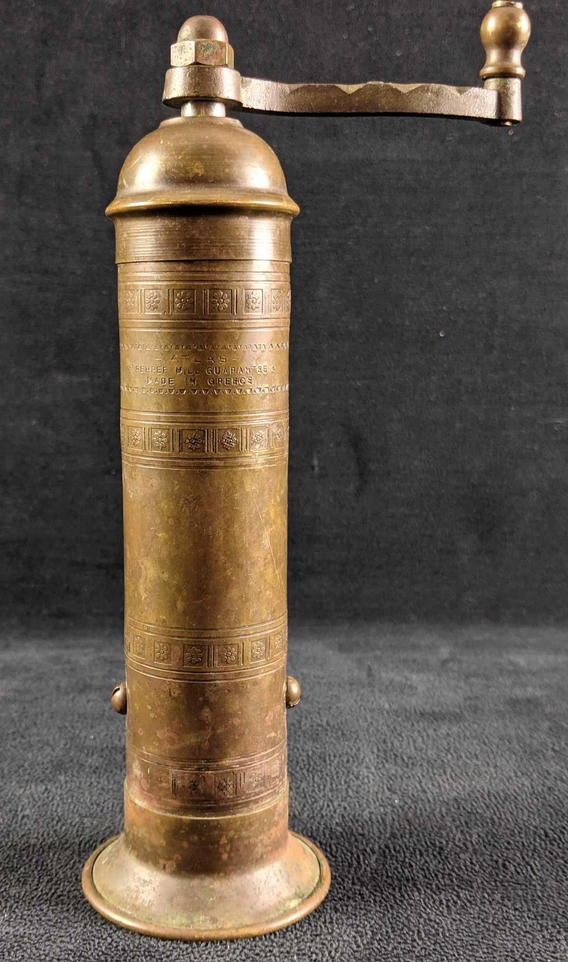 Vintage Atlas Brass Greek Pepper Mill: Vintage Atlas Brass Greek Pepper Mill This is a pepper mill from the brand Atlas made in Greece. This pepper mill is tarnished but in good condition. The handle turns and seems to work. It does not ha