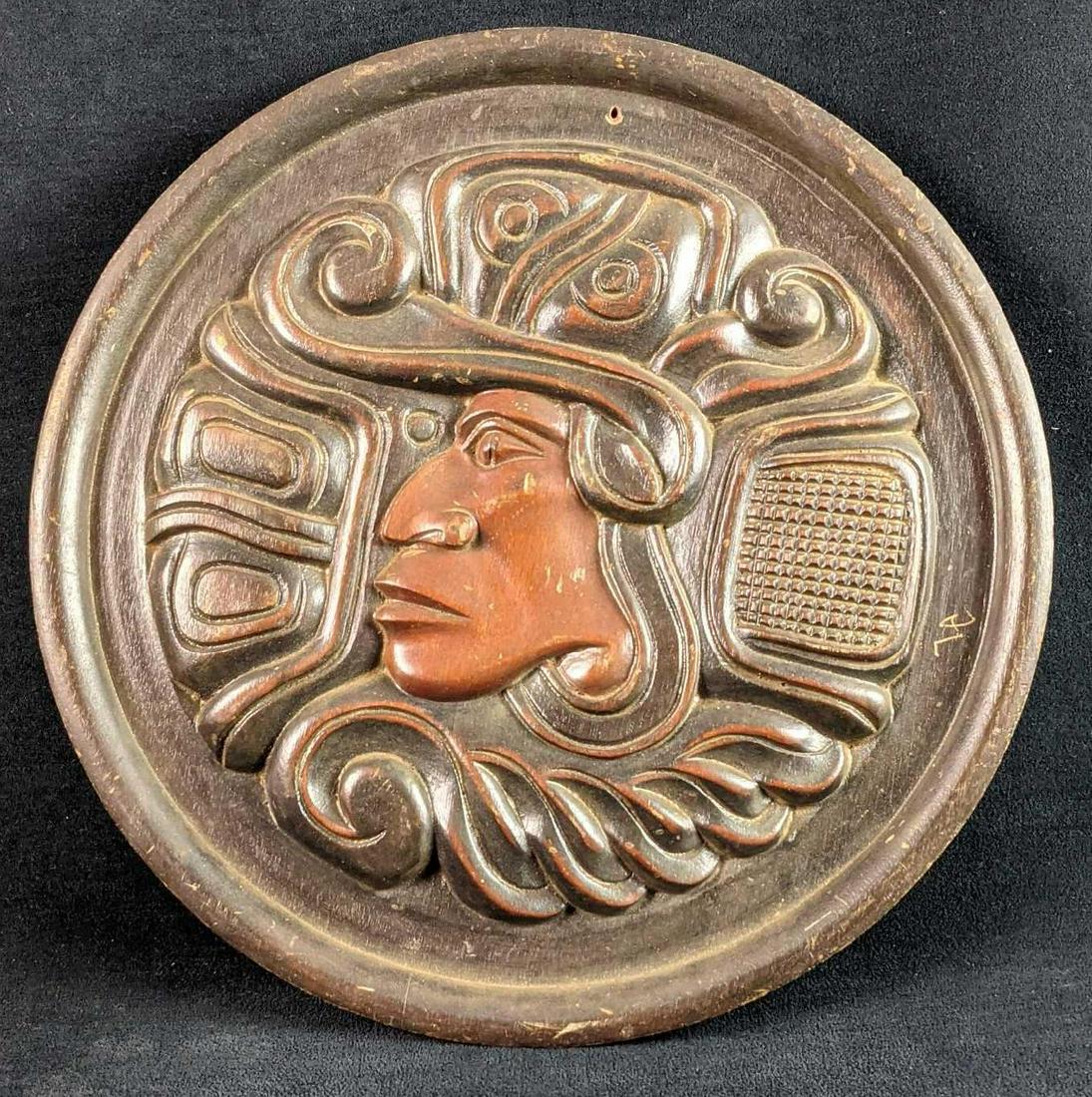 Hand Carved Round Mayan God Art: Hand carved wooden round hangable art of what appears to be Kukulcan. This was made in Honduras, Art is approx 13 1/4" x 13 1/4". Is a good, vintage conditon with some wear to the wood. Artist and tim