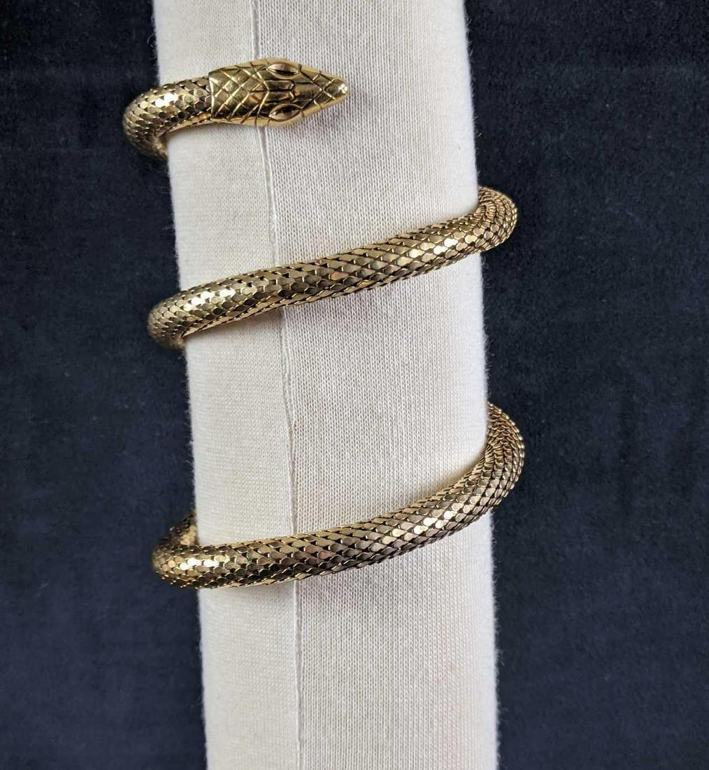 Gold Colored Snake Arm Cuff: Gold Colored Snake Arm Cuff This is a fashionable accessory for your night out. This snake arm cuff is in good condition with no known damage and is lightly used. Weight: 0.3lbs 3in