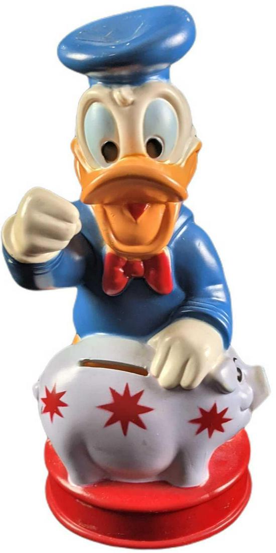 Vintage Disney Donald Duck Piggy Bang W Piggy: Oh Boy! Piggy bank shows Donald Duck just as he is about to smash his piggy bank! Thankfully, you don't have to smash this bank for the coins! The plastic bank was made by "Animal Toys Plus Inc" and i