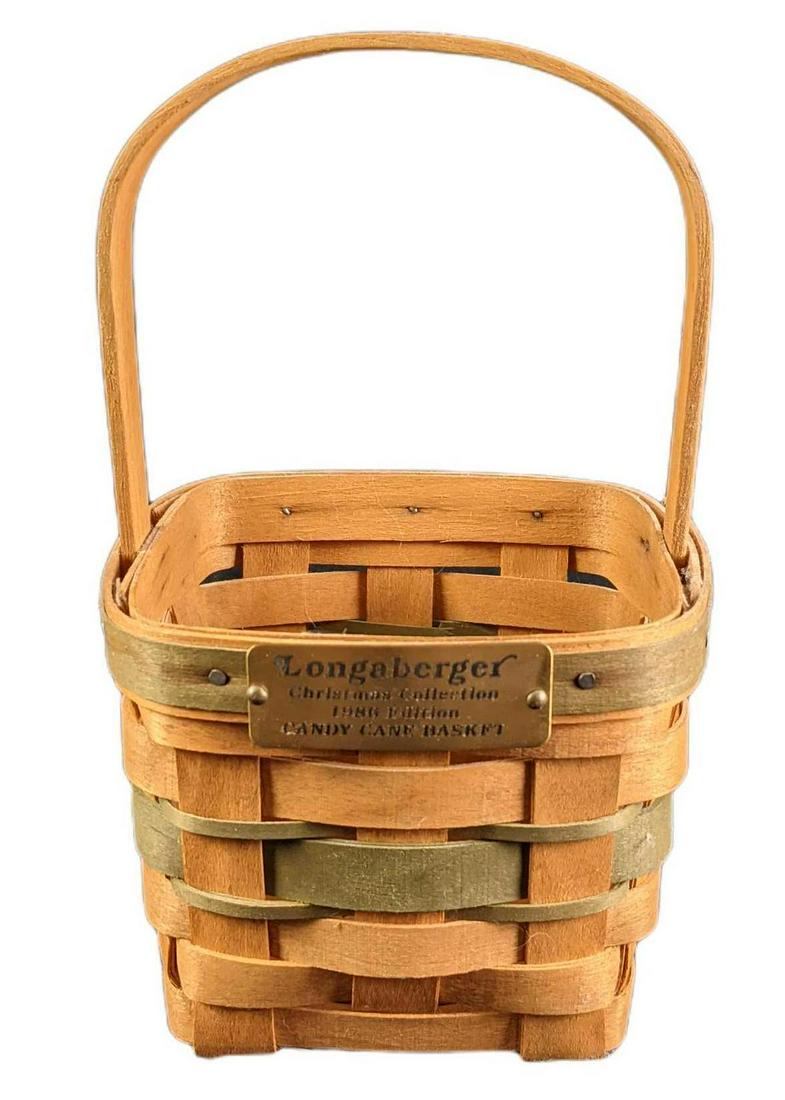 Longaberger Retired 1986 Christmas Candy Cane Basket: Longaberger retired 1986 Christmas Candy Cane basket. Includes the 6th in the series Christmas Candy Cane basket. Is approx 5" x 5" x 9" and weighs under one pound at 0.27lb. The basket is in a good,