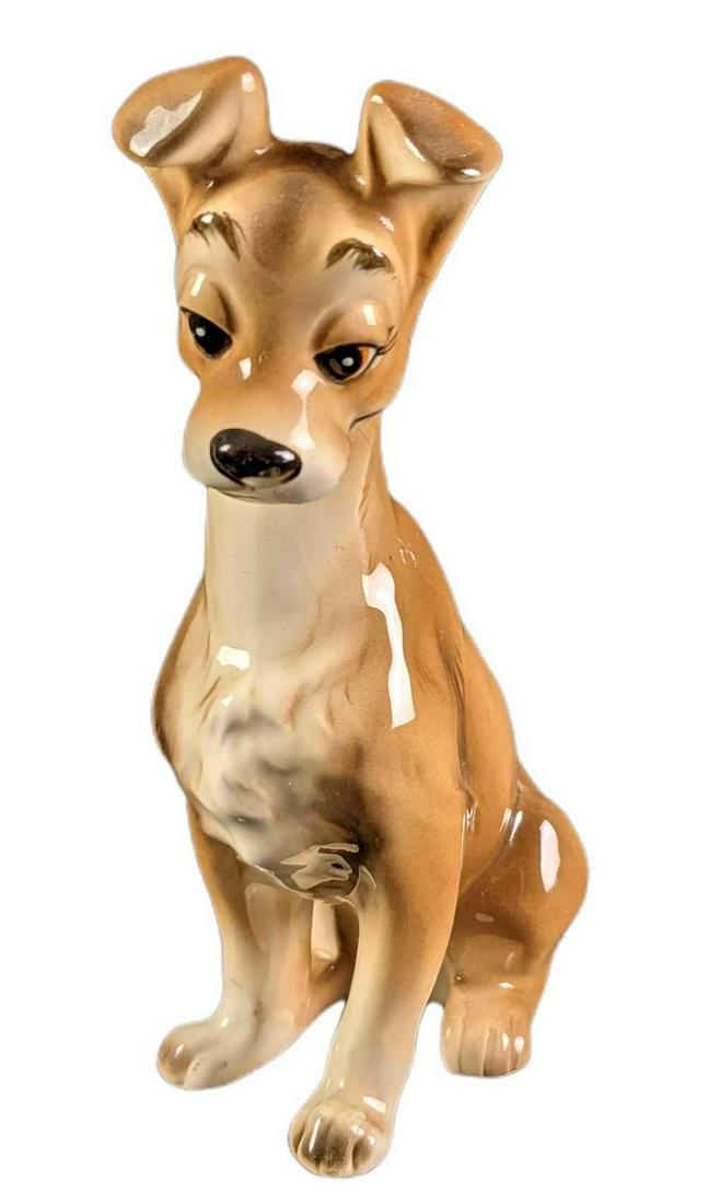 Vintage Disneys Lady And The Tramp Tramp Ceramic: From the classic animated Walt Disney movie, it's Tramp from "Lady & The Tramp". This ceramic figurine was made in Japan. Is marked Walt Disney Productions and Japan on the bottom. The figurine is app