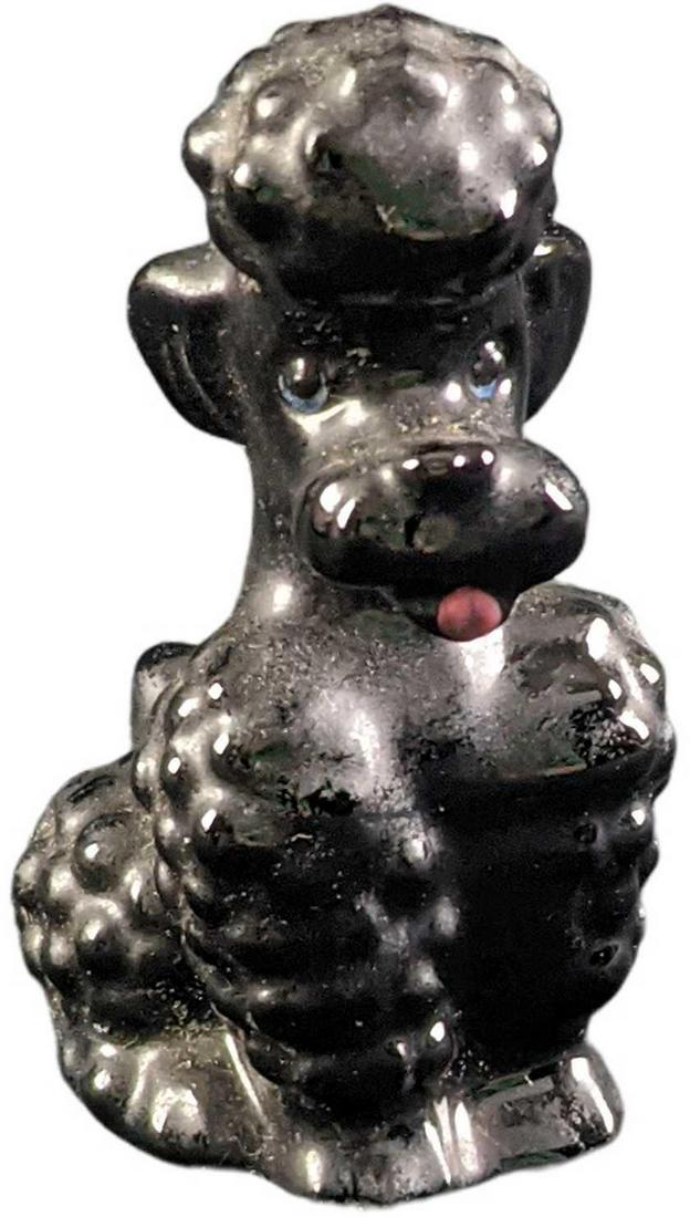 Vintage Goebel Sitting Black Poodle Figurine: Vintage Goebel Sitting Black Poodle Figurine. Made in Germany. The figurine is approx 1 1/2" x 1 3/4" x 3" and weighs under one pound at 0.07lb. The figurine is in a good, vintage condition with some