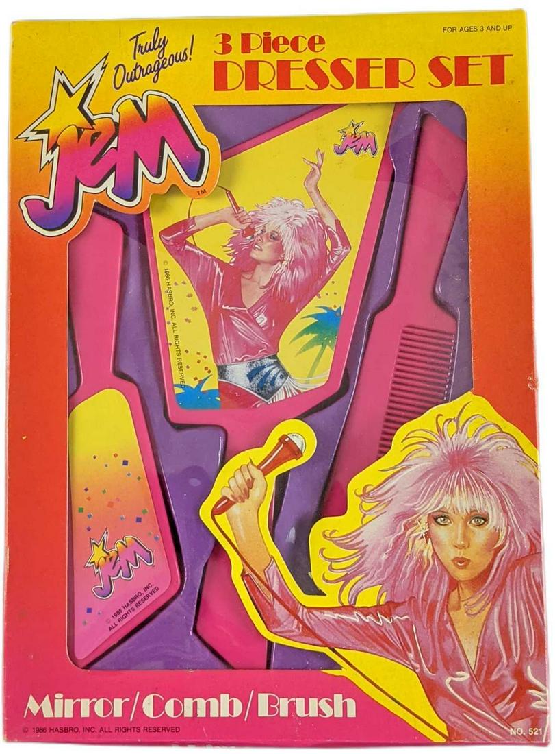 Jem: Truly Outrageous Mirror Comb & Brush Kit: Jem: Truly Outrageous Mirror Comb & Brush Kit. Was released by Hasbro and ARC on 1986. The box is approx 7 1/2" x 1 1/4" x 10 1/2" and it weighs under one pound at 0.36lb. Brush, comb and mirror are i