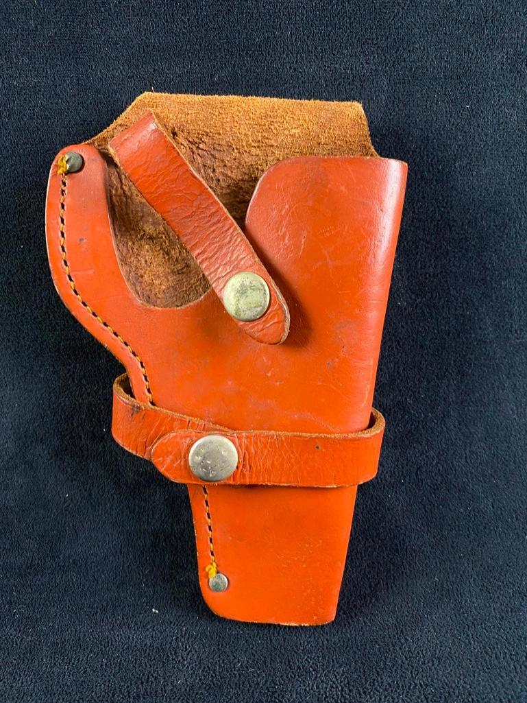 EIG Holster for 2" S&W K Frame: EIG Holster for 2" S&W K Frame Tan leather holster for Smith & Wesson 2" K-frame revolver. In good condition, with some wear on the leather and snap buttons. Has thumbsnap strap for quick release. App