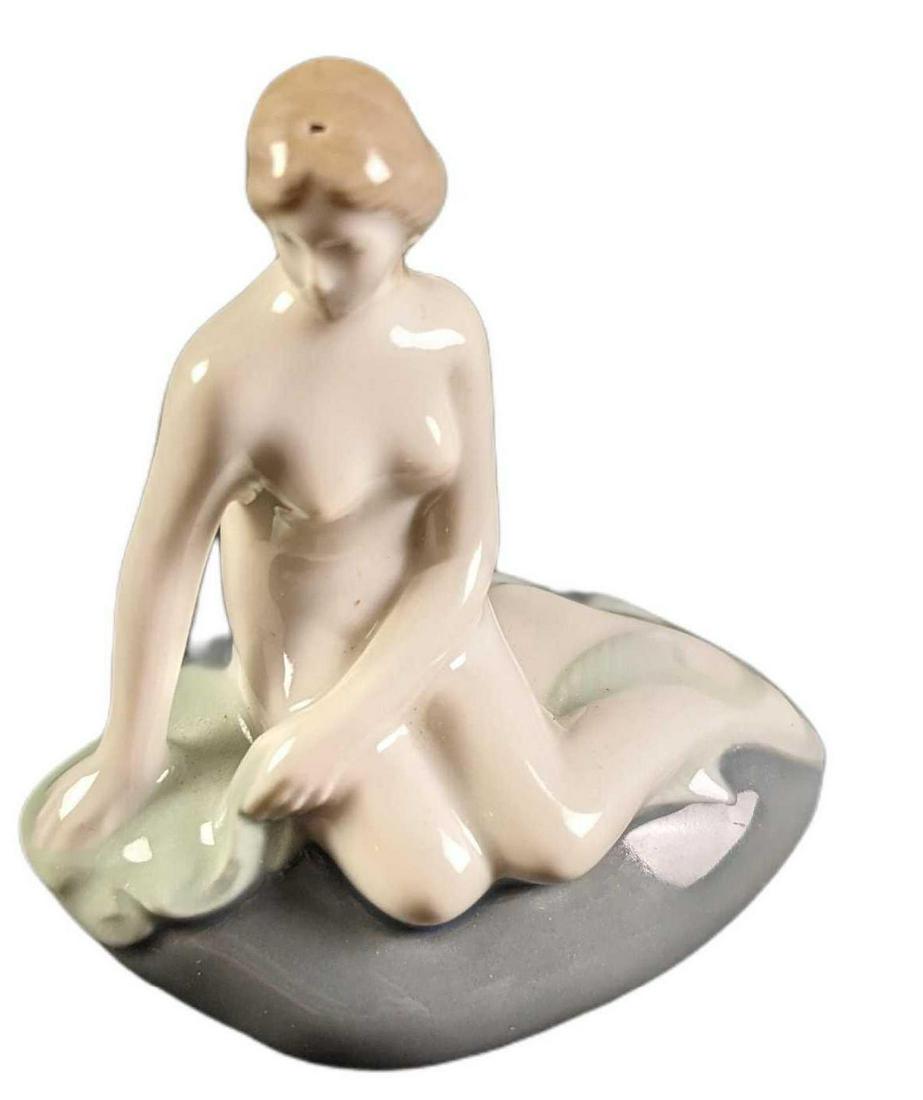 Vintage Royal Copenhagen Mini Little Mermaid Figurine: Here is a mini porcelain-based of the famous Little Mermaid statue designed by Edvard Eriksen that can be found in Copenhagen, Denmark. Is approx 3 1/2" x 2" x 3 1/2" and it weighs under one pound at 