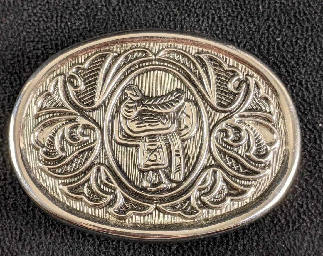 Vintage Belt Buckle Saddle Western Avon Buckle: Vintage Belt Buckle Saddle Western Avon Buckle This belt buckle is in great condition. It isn't tarnished nor has any known damage. The buckle is 3in long and 2 1/4in wide,