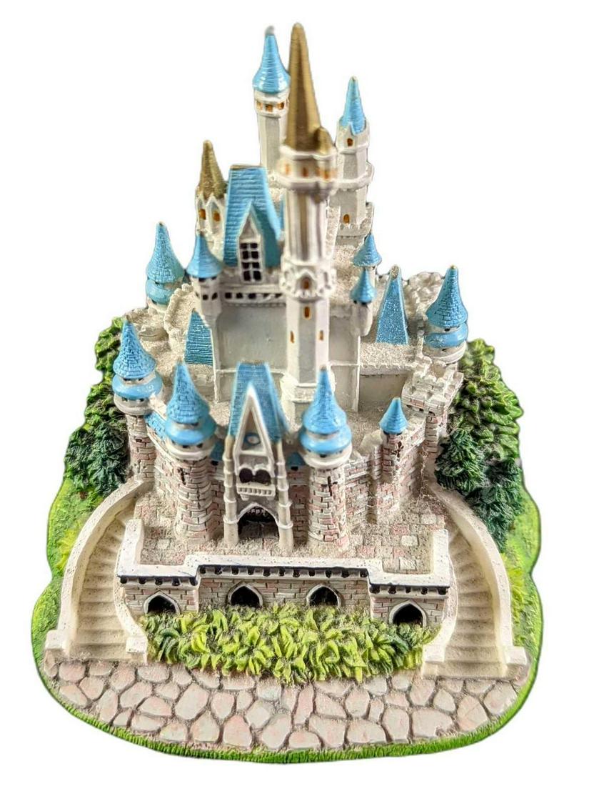 Mini Resin Disney World Cinderella Castle: Mini Resin Disney World Cinderella Castle. Cinderella castle now can fit on the palm of your hand! The castle is approx 3" x 3" x 3 1/2" and it weighs 0.36lb. The mini-castle is in a good, used condit
