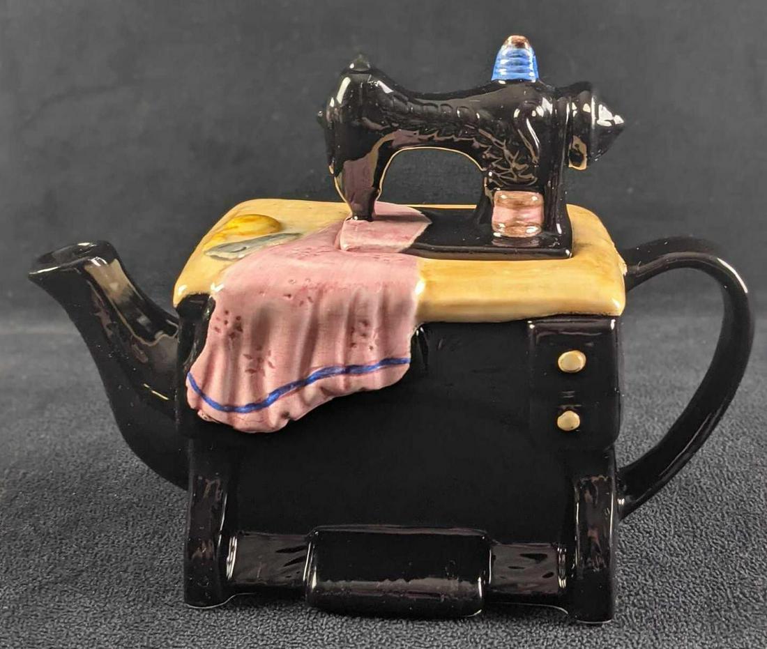 Ceramic Cardinal Inc Sewing Machine Collectable Tea Pot: Ceramic Cardinal Inc Sewing Machine Collectable Tea Pot. The hand-painted ceramic was released in 1995. Is approx 8" x 3 1/2" x 6" and it weighs 1.05lb. The tea-pot is in a good, used condition with s