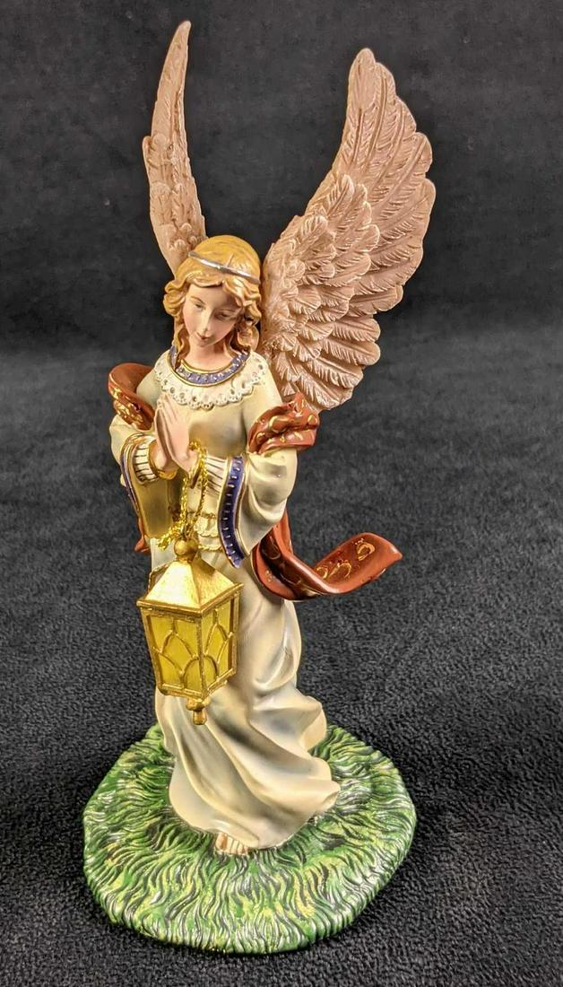 Hawthorne Village Thomas Kinkade Angel of Light: Hawthorne Village Thomas Kinkade Angel of Light. Made of a light resin and was released on 2007. Figurine is approx 3" x 3" x 7" and is in a good, used condition with light wear. No chips or cracks.