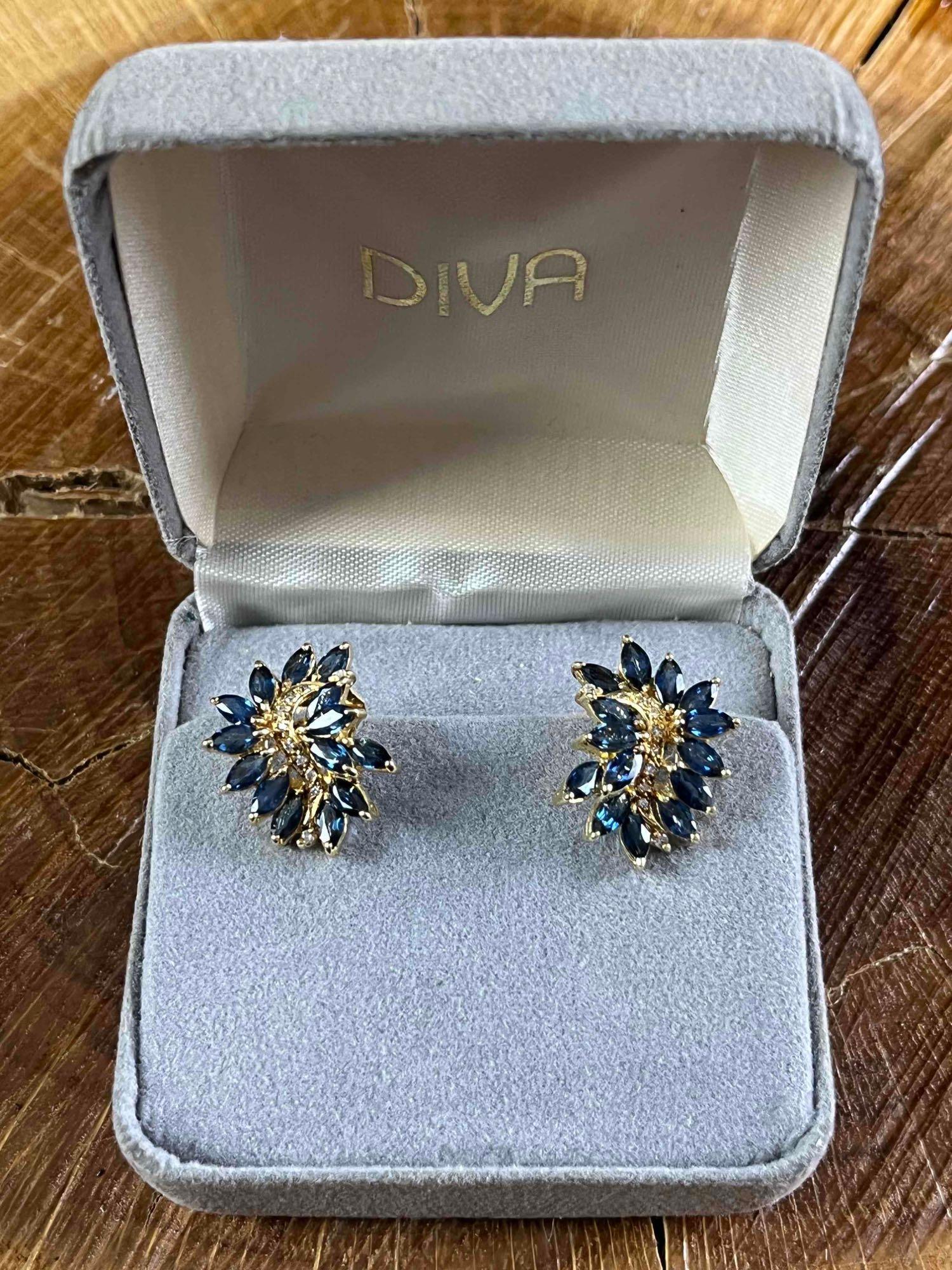Elegant Earrings Blue and Gold Gem Earrings: Elegant Earrings Blue and Gold Gem Earrings Pictured are like new vintage earrings with glass blue stones and a gold-colored setting. This earring set is like new in their original box. These earrings