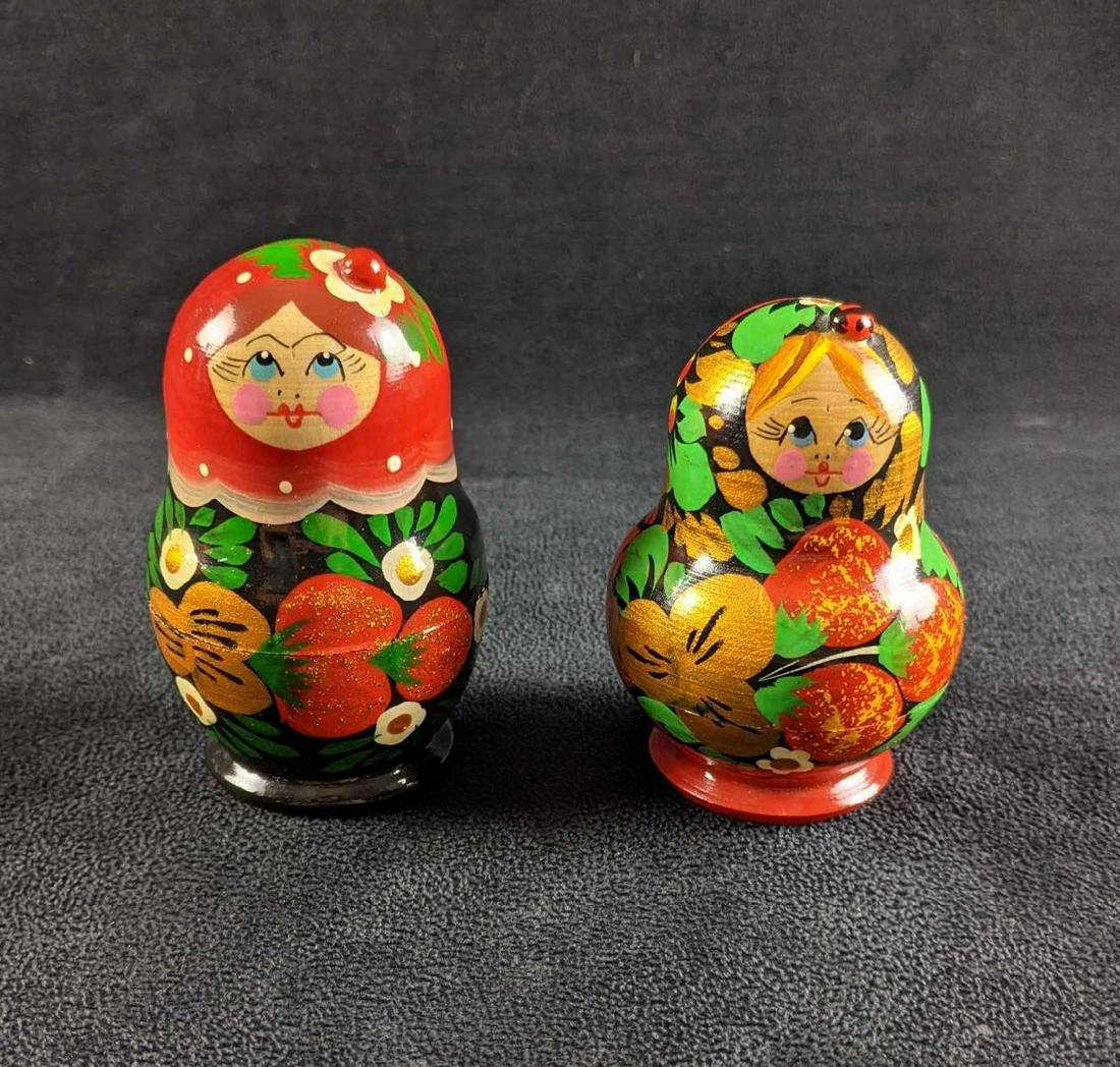 Wooden Russian Nesting Dolls: Russian Nesting Dolls This is a set of two Russian Nesting dolls. Both have five layers and are in good condition with minimal wear and no missing pieces. These look hand-painted. Both are approximate