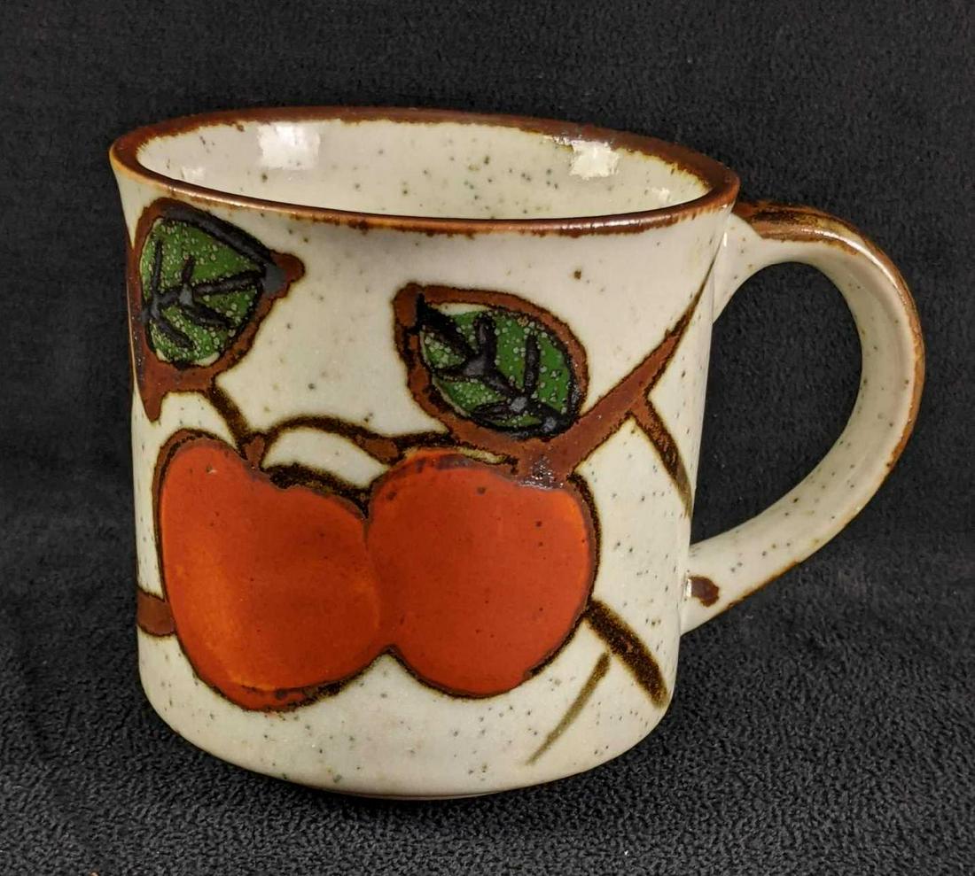 Vintage Handmade Mug Apple design: Vintage Handmade Mug Apple design This vintage mug was made using ball clay and glazed with a spotted glaze with an apple design on the front. The bug also has brown glaze accents. This mug is in grea