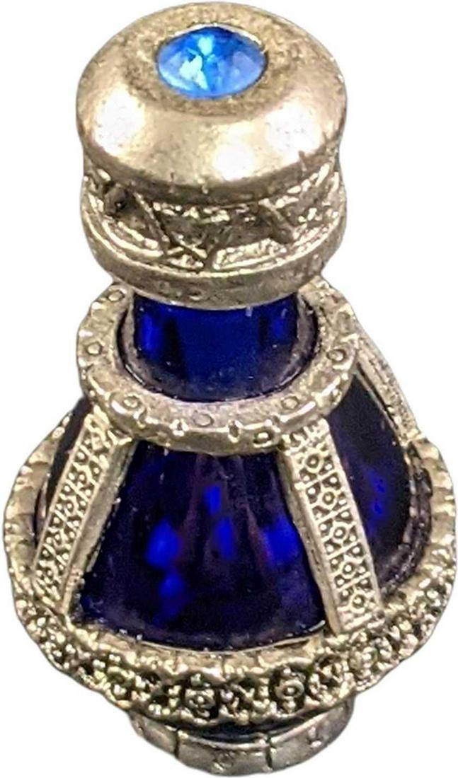 Silver Banded Roma Tear cobalt Glass Bottle: Antiqued nickel-silver plate filigree bands the deep cobalt glass bottle. Genuine Austrian Swarovski blue crystal stone in the cap. Original Timeless Traditions logo stamped on the bottom. Is approx 1