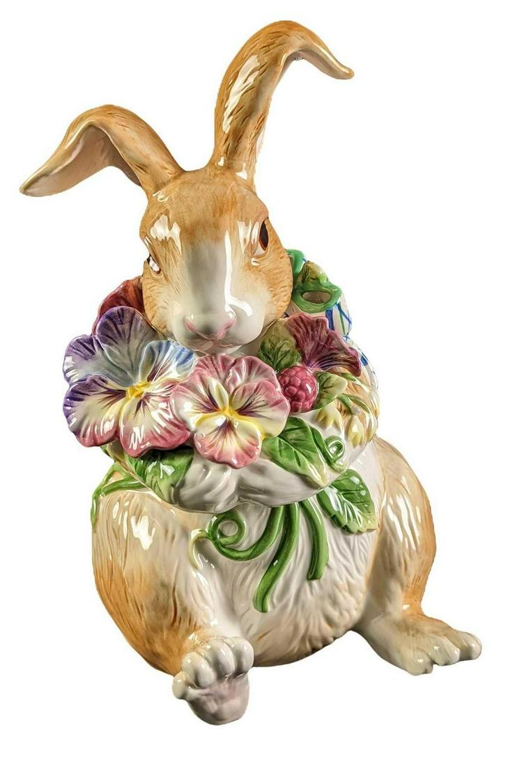 Retired Fitz and Floyd Halcyon Rabbit Cookie Jar: This vintage Fitz and Floyd Halcyon Rabbit ceramic cookie jar is a retired piece. It depicts a light brown rabbit with flowers in hand. Lovely Spring piece. In like-new condition with no known damages
