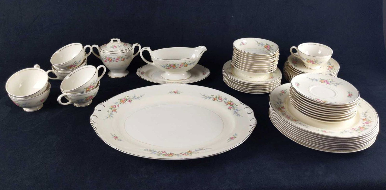 Vintage Homer Laughlin China Dinnerware Set Of 58: This set of vintage Homer Laughlin Eggshell Georgian China consists of: (1) Serving Platter. Which is approx 15 1/2" x 12". Has some wearing and light scratches. (9) Dinner-plates. Which are approx 10