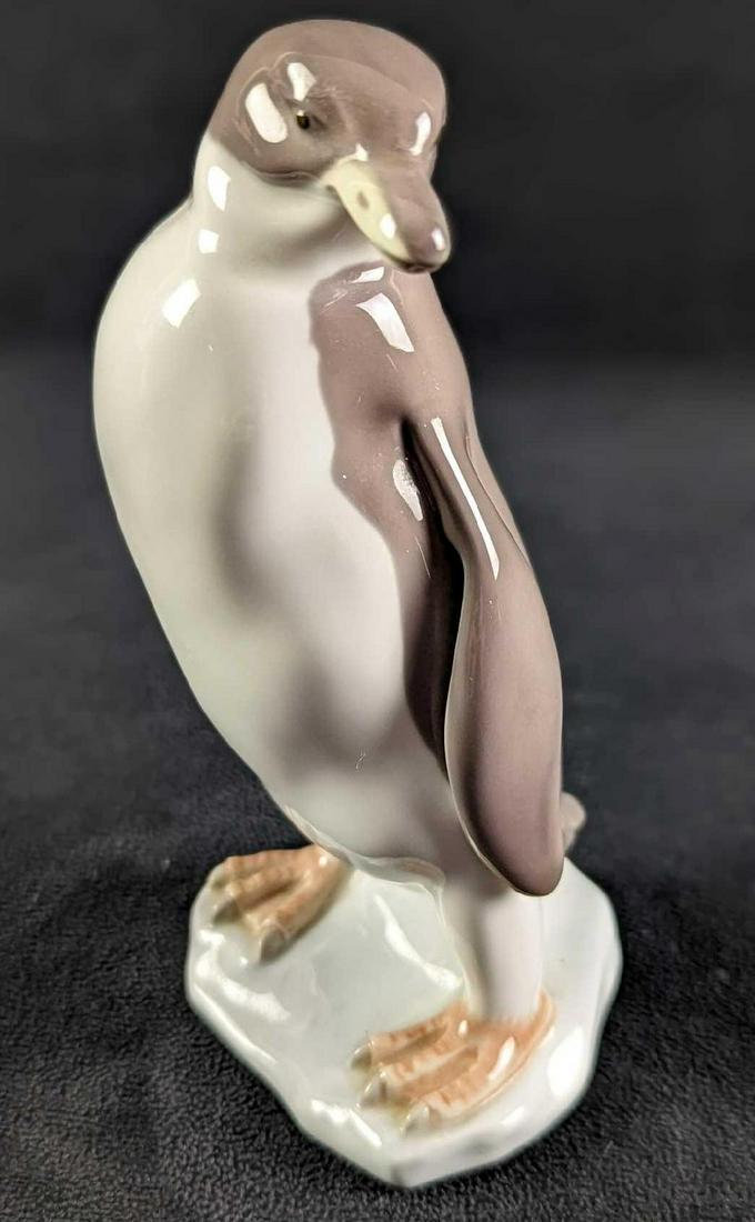 Lladro Penguin Porcelain Figurine: Lladro "Penguin" Porcelain Figurine. The figurine is approx 3" x 3" x 6" and it weighs 0.56lb. The figurine is in a good, used condition with no chips or cracks and has some wear on the bottom of the 