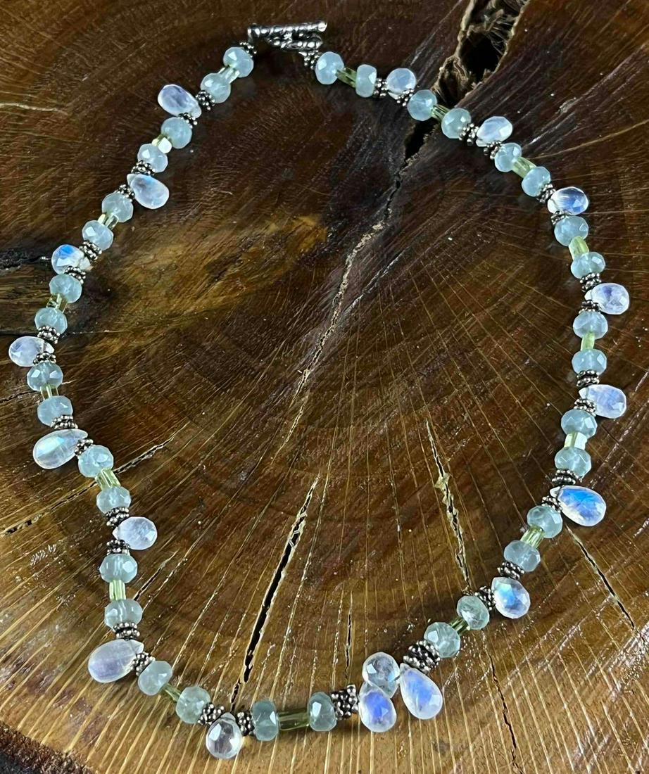 Moonstone and Topaz Necklace Sterling Silver: Moonstone and Topaz Necklace Sterling Silver Pictured is a handmade necklace made by jewelry designer Christina Dickson. Dickson used only the finest quality materials. This stunning piece is in great