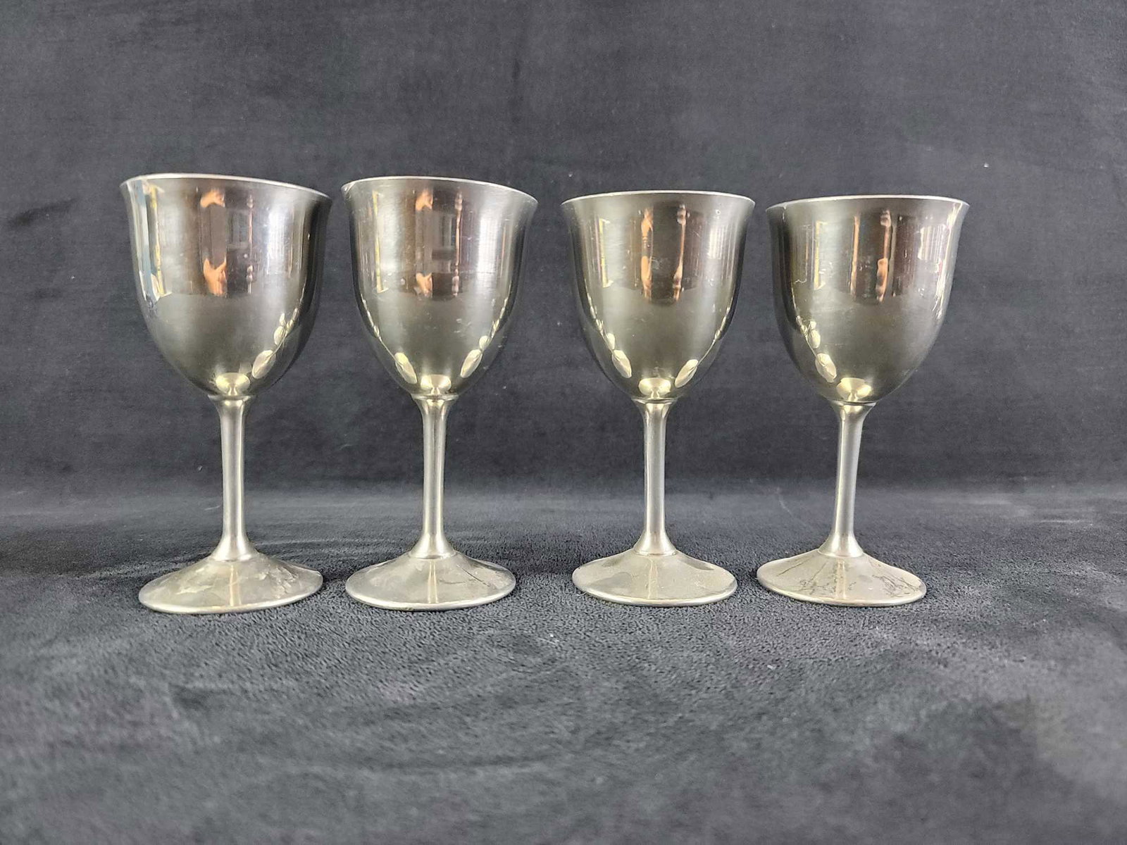 Shuler Quality Pewter Wine Goblets Lot of 4: This lot contains 4 Shuler Quality Pewter wine goblets. Each one is stamped on the bottom . They are in good used condition, with some surface scratches. Need a good polish. Approx. measures 2 1/4" ba