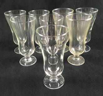 Set of 8 Daiquiri Glasses: Set of 8 Daiquiri Glasses. This set is in good condition. None of the glass is cracked or chipped. Set will need to be cleaned. The glasses are all the same model. Each glass measures 6" H by 2.75" W.