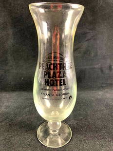 Peachtree Plaza Hotel Beer Glass: This lot includes: (1) Peachtree Plaza Hotel Beer Glass Condition is used and refer to photographs for additional details. The beer glass is in good shape with no evident crack or chips. The