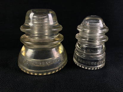 Two Antique Glass Telephone Insulators: Two Antique Glass Telephone Insulators Lot of two telephone insulators, one large and one small, made by Hemingray. The larger insulators were usually used for power and phone lines, while the