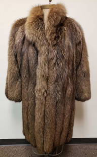 Goldin Feldman Tanuki Fur Coat: Goldin Feldman Tanuki Fur Coat. This fur coat is in great used condition. The coat has no known damage to the interior or exterior. The coat has a hook and loop closure and two concealed exterior