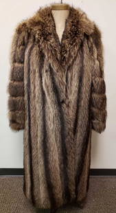 Fur Boutique Germany Raccoon Fur Coat: Fur Boutique Germany Raccoon Fur Coat. This fur coat is in great used condition. The coat shows no obvious signs of damage to the interior or exterior. The coat has a hook and loop closure with two
