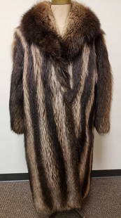 Full Length Raccoon Fur Coat: Full Length Raccoon Fur Coat. This raccoon fur coat is in good used condition. The only known damage to the coat is a few loose threads at the front where it looks like a tag used to be. The interior