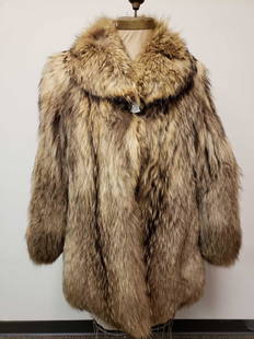 Mid Length Murmasky Fur Coat: Mid Length Murmasky Fur Coat. This fur coat is in great used condition. The coat has no known signs of damage to the interior or exterior. The coat has a light brown fabric interior lining with the