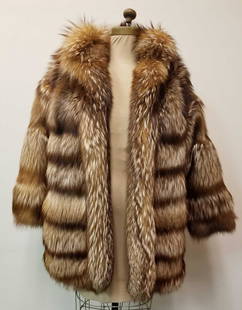 Tanuki Fur Coat by Ambrosio Napoli: This beautiful Tanuki fur coat by Ambrosio Napoli is in great used condition with no known damages. This coat features dark brown linen interior with 2 outside concealed pocket and no closures.