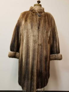 Fisher Fur Coat by Gurvitch Furs: This fine fisher fur coat by Gurvitch furs is in great used condition with no known damages. This coat features dark brown linen interior with the initials "TGJ" inside the right panel, a rectangular