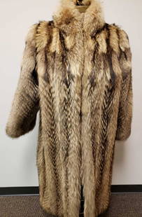 Full Length Murmasky Fur Coat: Full Length Murmasky Fur Coat. This fur coat is in great used condition. There is no known damage to the interior or exterior of the coat. The coat has a gold fabric interior lining with the name