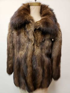 Mid Length Fisher Fur Coat: Mid Length Fisher Fur Coat. This fur coat is in great used condition. There is no known damage to the interior or exterior of the coat. The coat has a diamond patterned brown interior fabric lining.