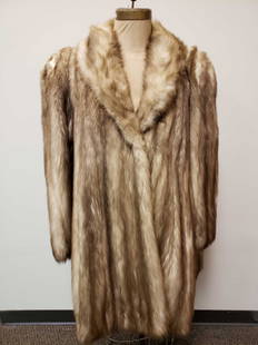 Giorgio and Laura Stone Marten Fur Coat: Giorgio and Laura Stone Marten Fur Coat. This fur coat is in great used condition. There is no known damage to the interior or exterior of the coat. The coat has a tan colored interior lining with