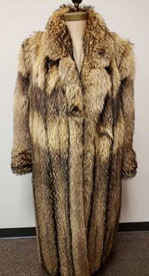 Hinsdale Furriers Murmasky Fur Coat: Hinsdale Furriers Murmasky Fur Coat. This fur coat is in great used condition. There is no known damage to the interior or exterior of the coat. The coat has a brown colored fabric interior lining