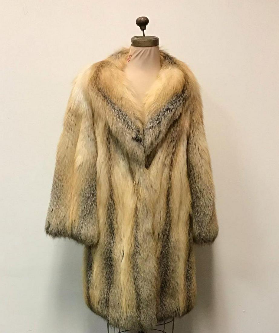 Golden Isle Luxury Fur Coat: Golden Isle Luxury Fur Coat. Made by an unknown manufacturer. This coat features two exterior pockets, three hook and clips and dark brown linen. It is in good used condition with some known ware on t