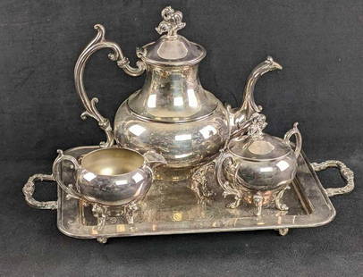 Silver Plate Tea Set 4pc Tea Set: Silver Plate Tea Set 4pc Tea Set This is a 4pc tea set with a tray, teapot, creamer pourer, and sugar bowl. All items are footed. This is a full silver plated set. The set is in good condition