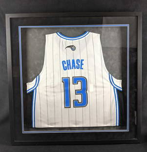 Framed Orlando Magic Basketball Jersey Chase Bank: This is an framed Orlando Magic Jersey marked with the #13 and Chase in honor of Chase Bank becoming the official bank of the Orlando Magic basketball team. Home colors. Frame is approx 33" x 2" x