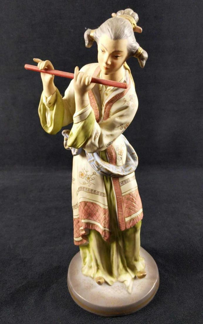 Andrea by Sadek Porcelain Lady With Flute: This vintage Japanese figurine by Andrea of Sadek is hand painted in very soft colors on bisque porcelain. This figurine is of a lady playing a flute. She is dressed in traditional entertainer's garb.