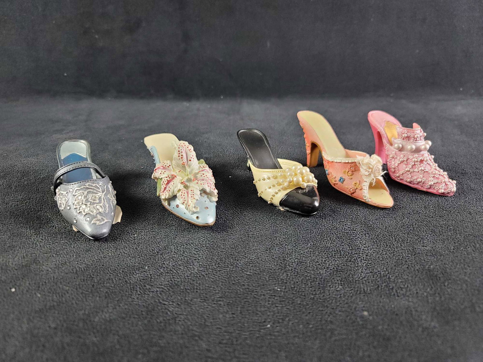 Minature Shoes Just The Right Shoe: This lot contains: 1- Paula's Perfect Fit Shoes, bright pink, approx. measures 3" x 1 1/4" x 1 3/4" 1- Unbranded slip on heel with floral design, approx. measures4" x 1 1/2" x 1 3/4" 1- Willitts Desig