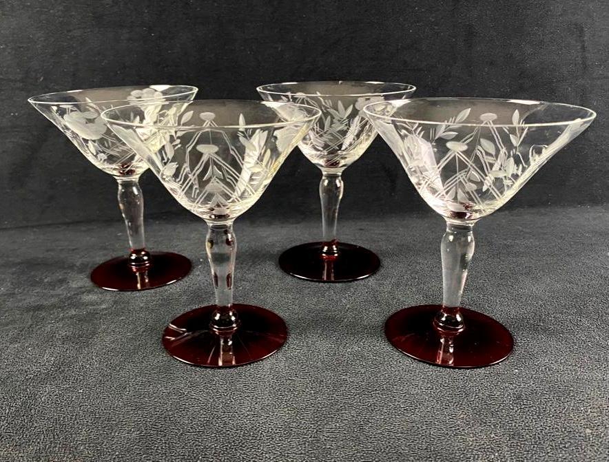 Set of 4 Mid-Century Cocktail Glasses: Set of 4 Mid-Century Martini Glasses These vintage martini glasses feature hand-engraved floral designs around the sloped sides, with a red base at the bottom. One glass has a slight crack in the side