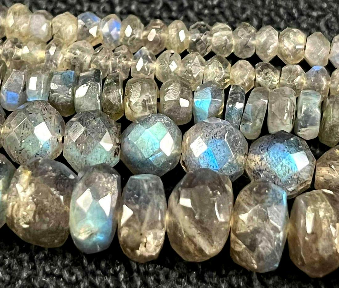 Labradorite Faceted Rondelle Cut Bead Strands: Labradorite faceted Rondelle Cut Bead Strands Here is a lovely lot of labradorite beads for that jewelry artist out there. Also, a great set to purchase and have a jeweler design a one-of-a-kind piece