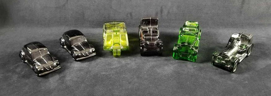 Avon Glass Car Lot of 6: Avon glass car aftershave bottles is a lot of 6 and contains: 2- Volkswagen "Spicy", empty and one is missing the cap cover. Approx. measures 5 1/2"x 2 1/4" x 2 1/4" 1- Golf Cart "Wild Country" empty